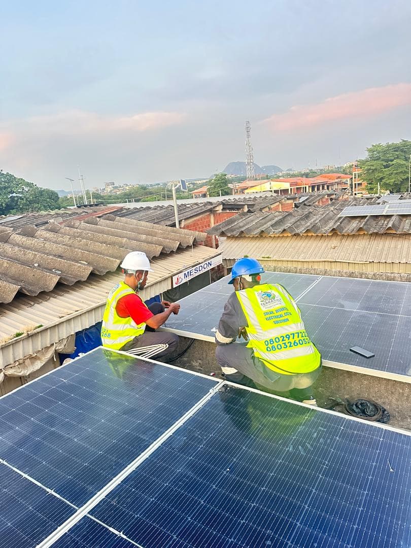 Terravolt technicians wiring rooftop solar panels